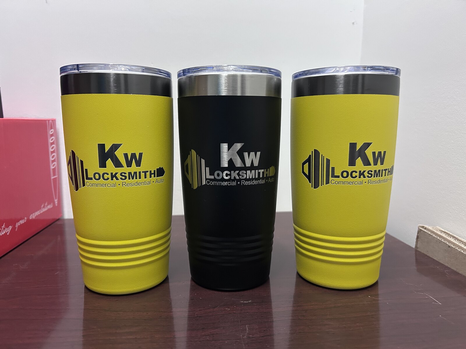 KW Locksmith — 20oz yellow and black tumblers · full-color and engraved logo