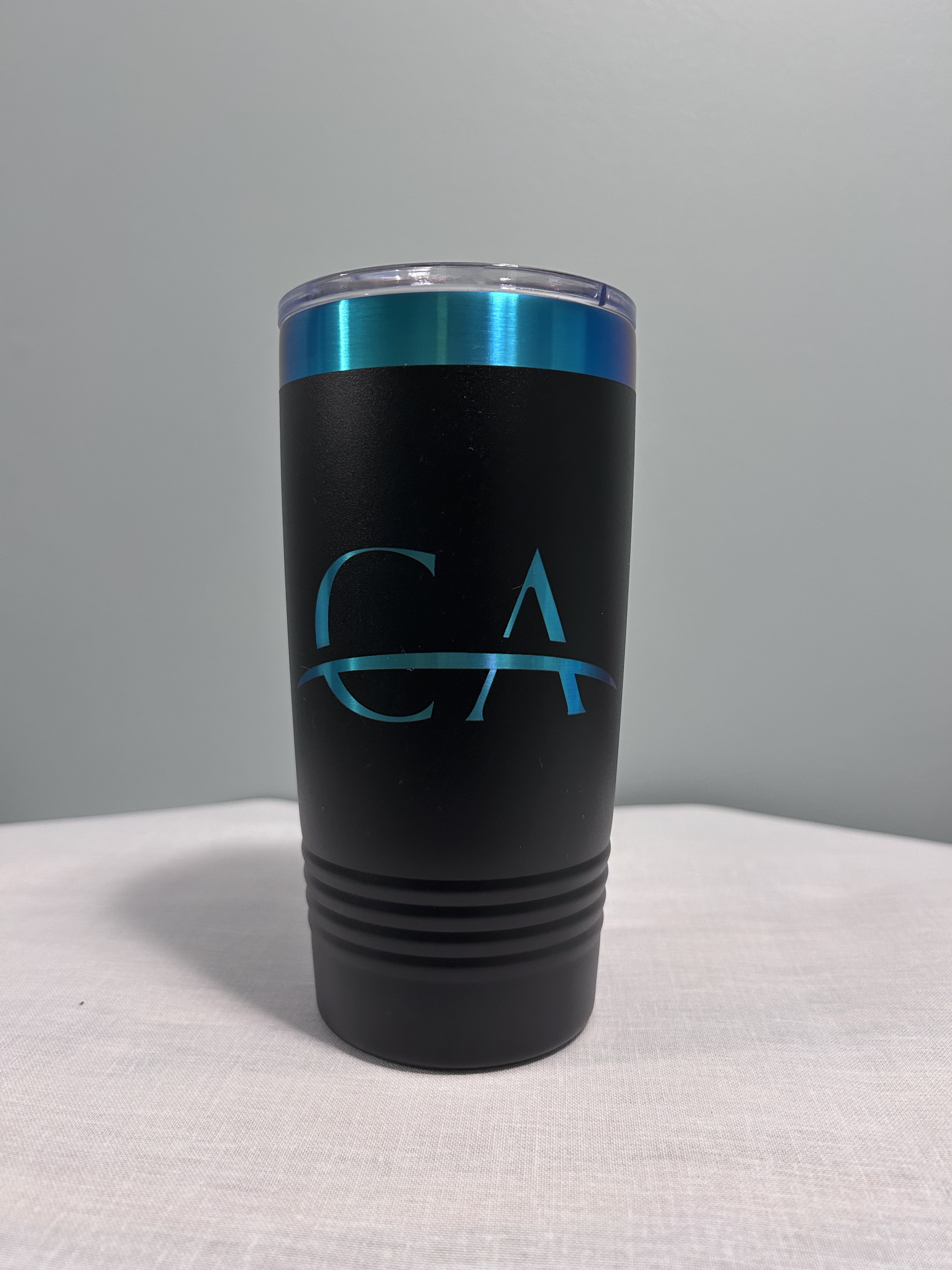 CA — 20oz matte black tumbler · teal logo, teal ring lid