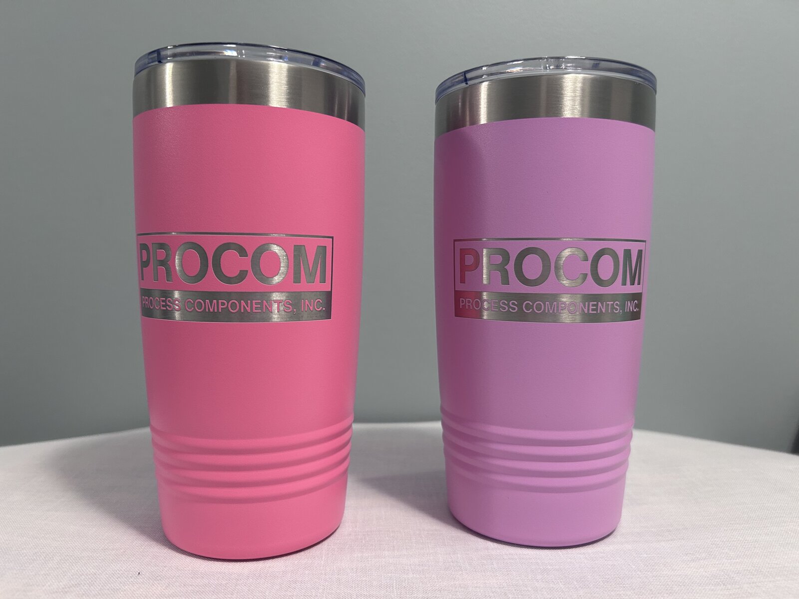 Procom — Pink and lilac 20oz tumblers · engraved logo